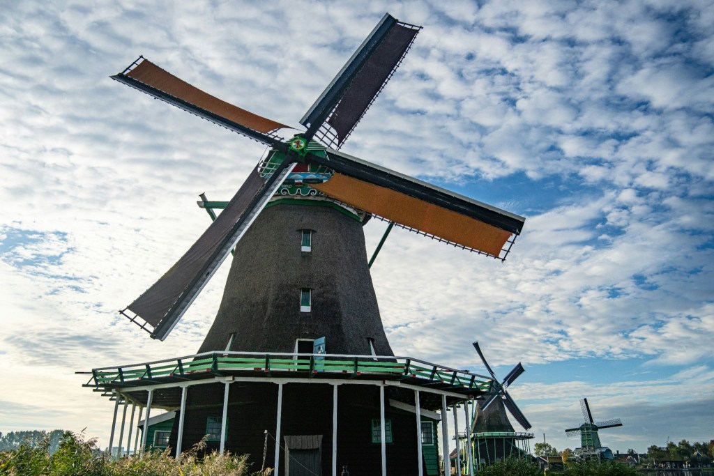 Windmill in the Netherlands' countryside, amazing for summer activities and among the best Netherlands landmarks.