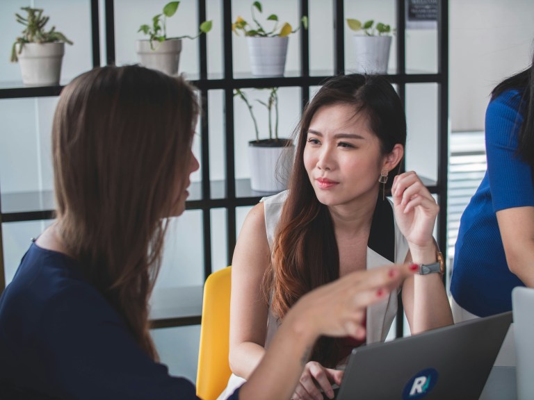 Two people talking about how to negotiate salary and how to negotiate pay rate effectively.