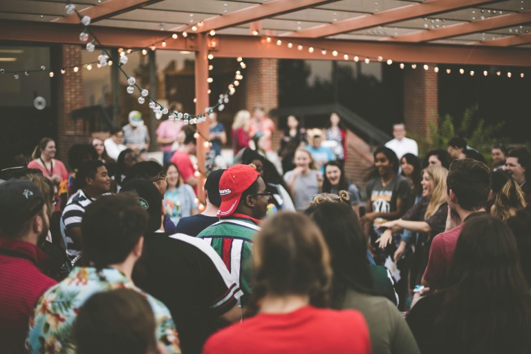 Colleagues gathered in a circle during a cultural ritual that builds community at work.