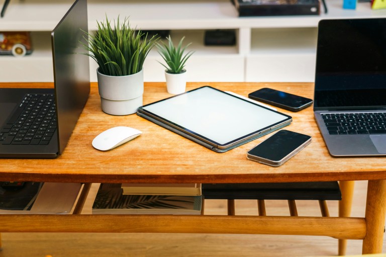 Desk and laptop representing healthy workplace standards supported by employee wellbeing policies in a modern EU work environment