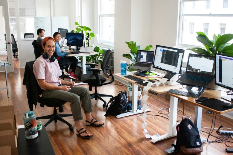 Tech startup team planning international hiring with best employer of record support