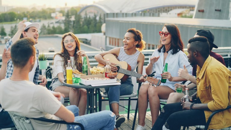 Team social event supporting how to manage stress at work through connection