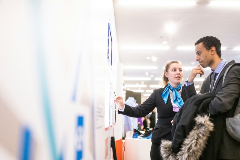 Employer explaining Amsterdam vacancies to an EU expat.
