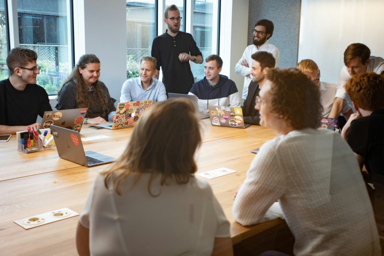 Business meeting of a company deciding wether to expand to Netherlands, Germany or Belgium for their first EU business entity.