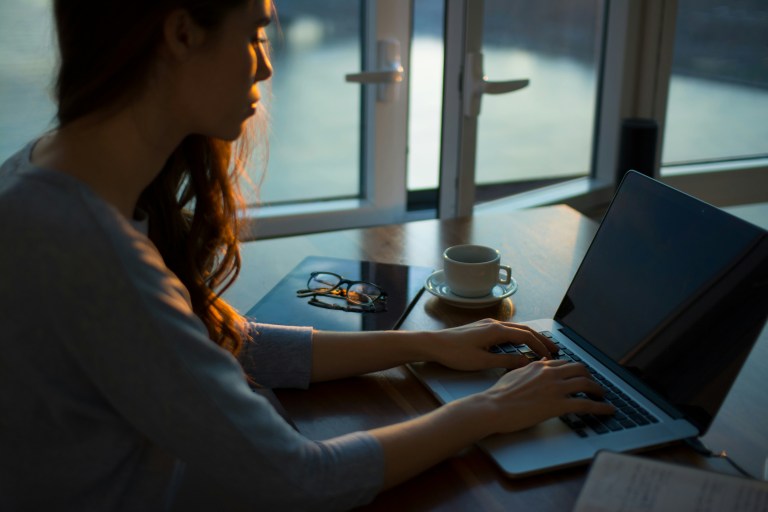 HR manager drafting a right to disconnect policy on a laptop