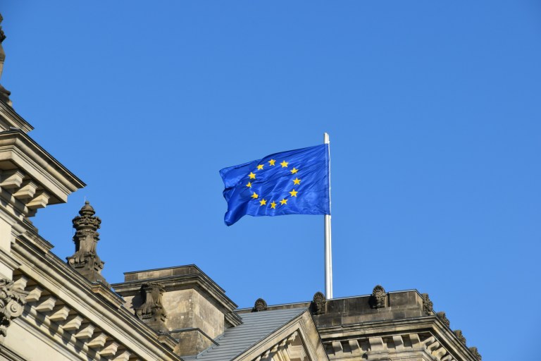 Flag of the European Union representing the EU pay transparency directive compliance.