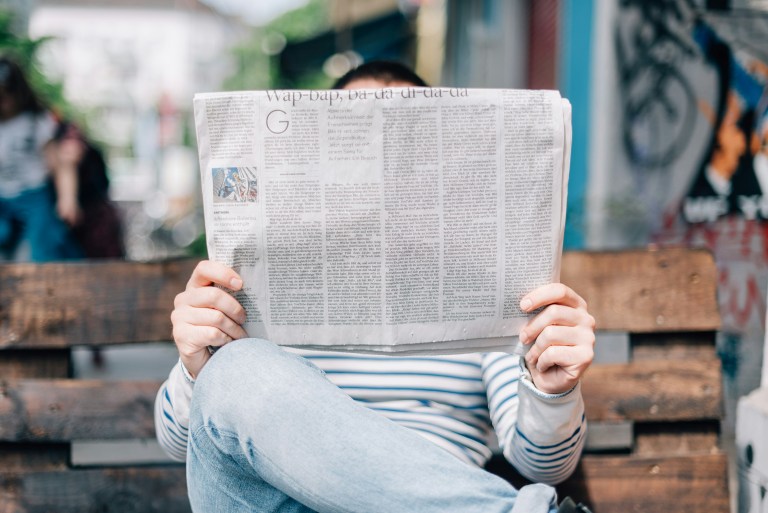 Expat reading a newspaper representing Dutch law changes 2026.