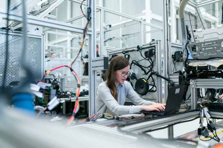 An engineer working in a robotics factory representing Dutch technology hubs.