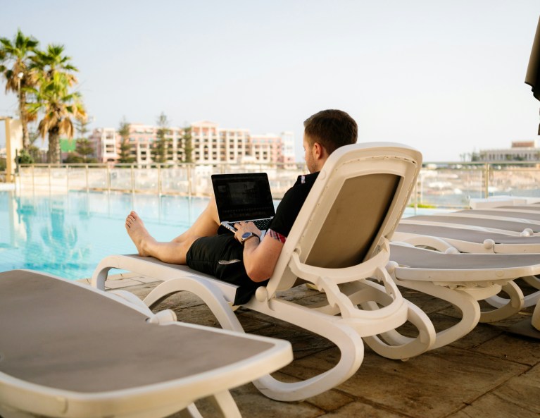 HR manager reviewing remote work compliance policy for Dutch employee working from home abroad